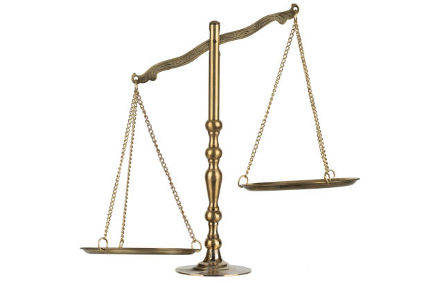 istock Bronze traditional balance scale with weights isolated on white 2190117821