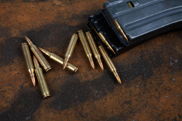 istock Ammunition with magazine on rusty metal 2190117932