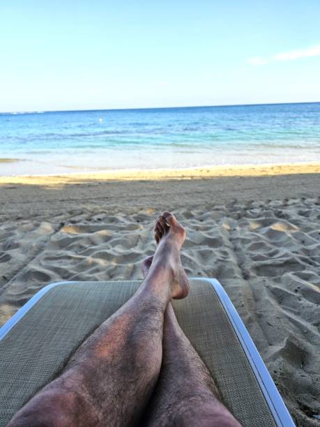 istock Relaxing at the beach with my feet up. 2190117953