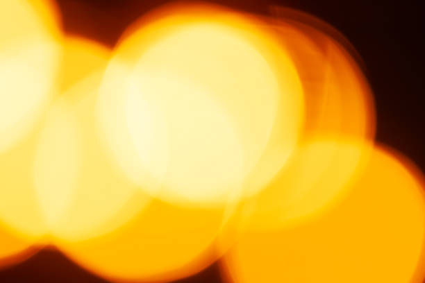 istock Blurred lights of electric garland, yellow warm light 2190118113