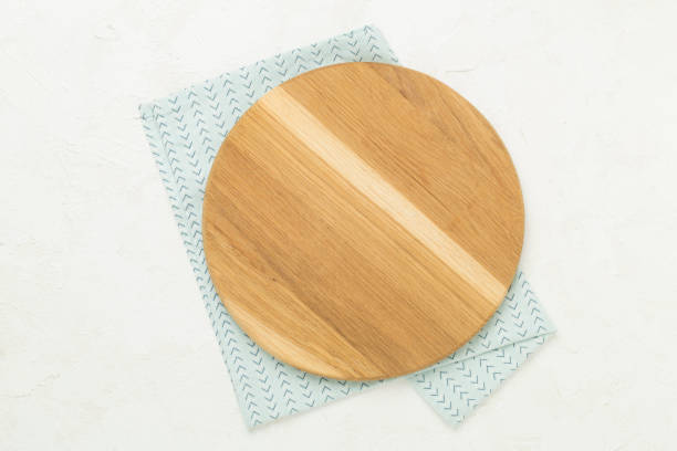 istock Cutting board with napkin on concrete background, top view 2190127554