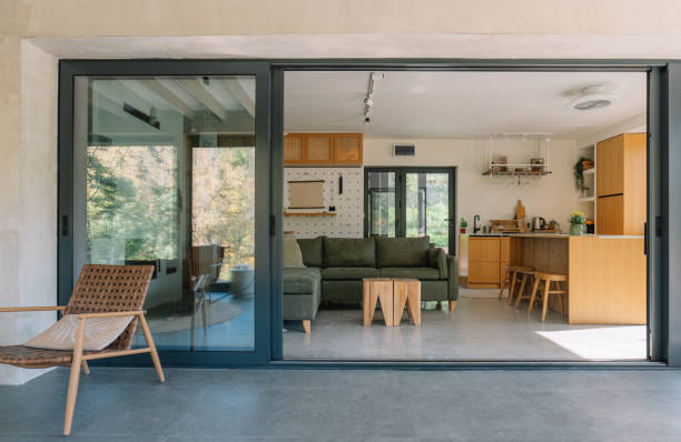 istock Modern open-concept wooden cabin interior with living room and kitchen view 2190129463