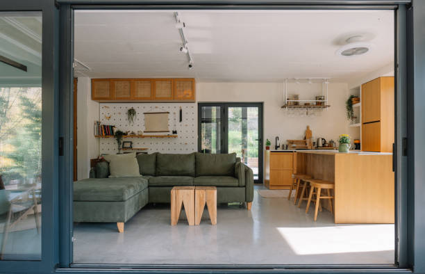 istock Modern open-concept wooden cabin interior with living room and kitchen view 2190129469