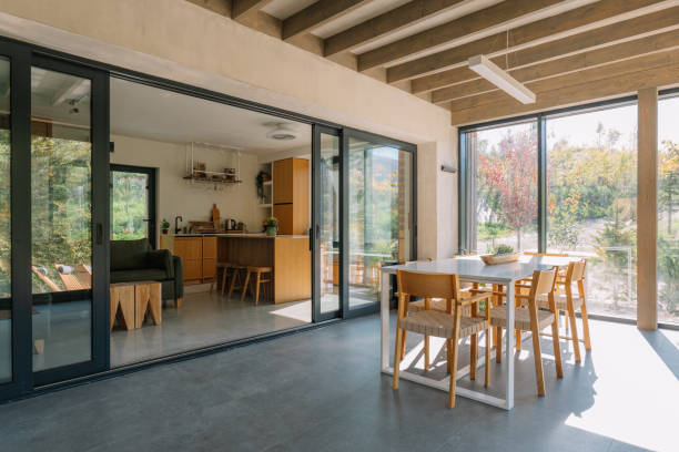 istock Modern wooden cabin interior with natural light and scenic forest view 2190129474
