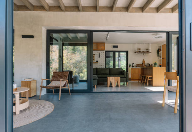 istock Modern open-concept wooden cabin interior with living room and kitchen view 2190129477