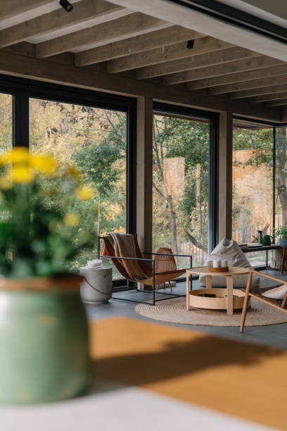 istock Modern wooden cabin interior with natural light and scenic forest view 2190129481