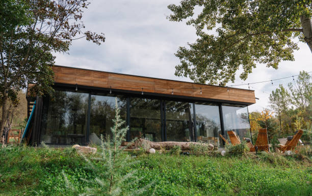 istock Modern glass cabin with wooden exterior in a natural setting 2190129487