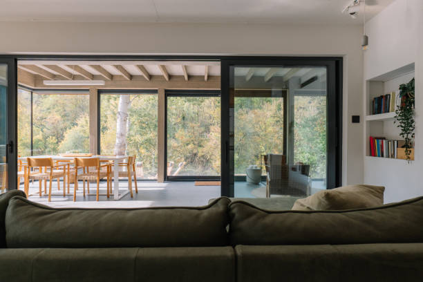 istock Modern wooden cabin interior with natural light and scenic forest view 2190129492
