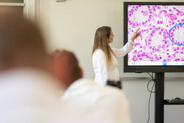 istock Caucasian Veterinary Professor Teaching Microscopic Anatomy 2190132384