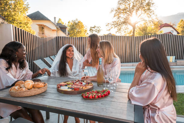 istock Snack Time at the Bachelorette Bash with Indian Bride and Diverse Friends 2190133653