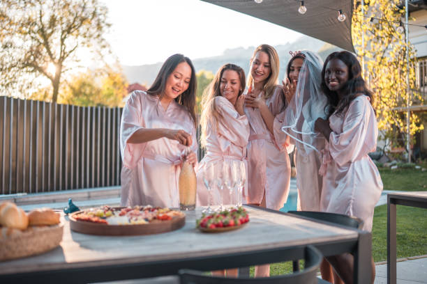 istock Joyful Indian Bride-to-Be Celebrating Bachelorette Party by the Pool 2190133657