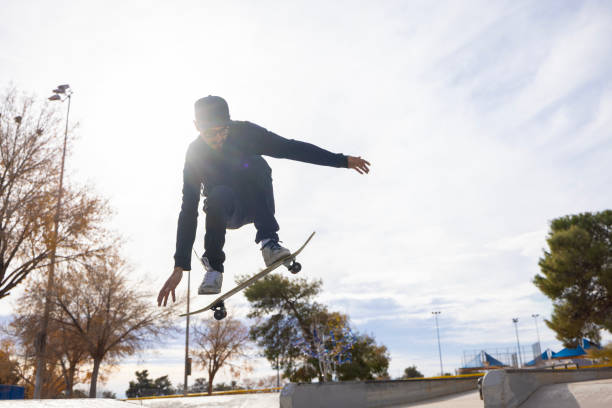 Free Stock Photo of Sunset skateboard trick at urban skate park ramp ...