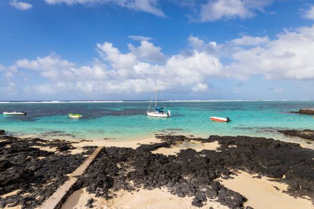 istock Serene Tropical Beach with Crystal Clear Waters and Rocky Shoreline, Mauritius 2190152649