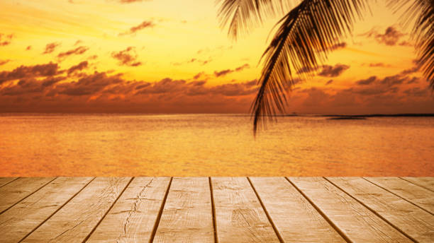 istock Empty wooden table top with tropical ocean sunset twilight background 2190154154