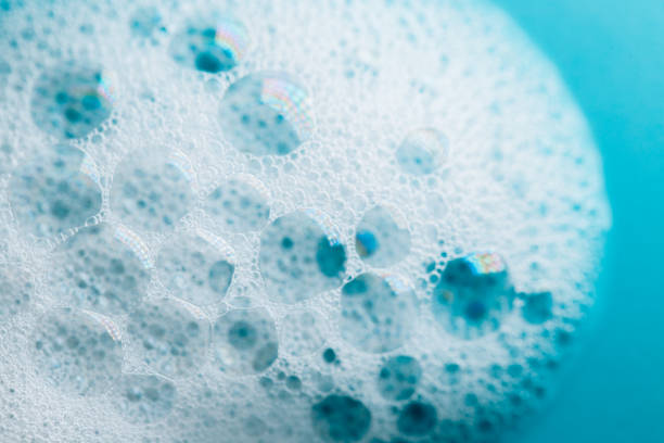 istock Foam Water Soap Suds.foam bubbles.Foaming cleaning products.Texture Foam. soap bubbles background. 2190155199