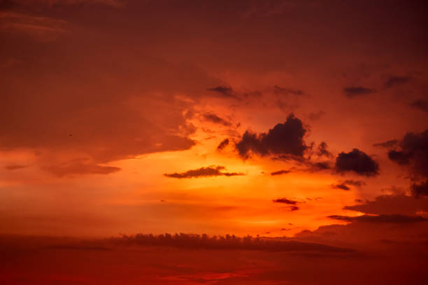 dramatic orange clouds in the dark sky