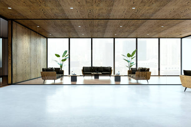istock Modern and stylish open office lounge with large windows and wooden interiors. 3D Rendering 2190159134
