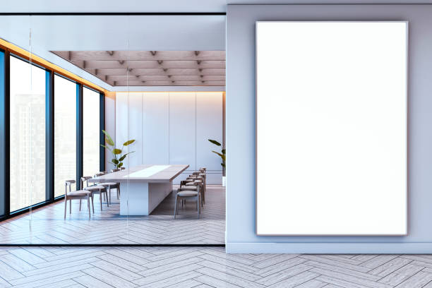 istock Modern conference room interior design with large blank vertical poster and wooden elements, city view through large windows. 3D Rendering 2190159164