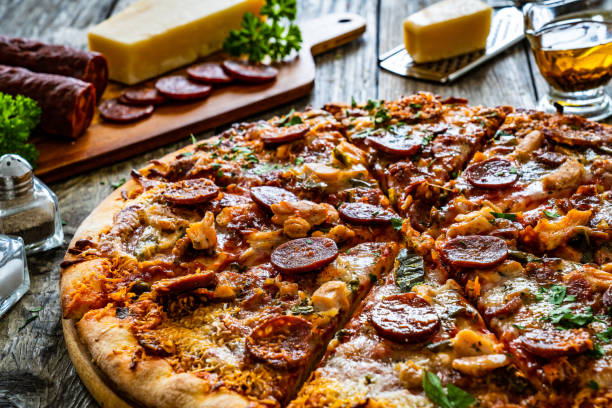 istock Pizza with chorizo and mozzarella on wooden table 2190164477