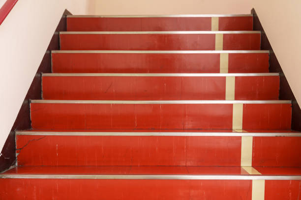 Material of the red staircase in the building