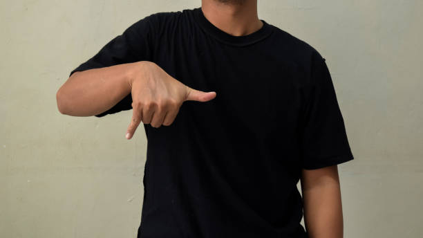 istock Young man showing gesture in sign language on gray background 2190168695