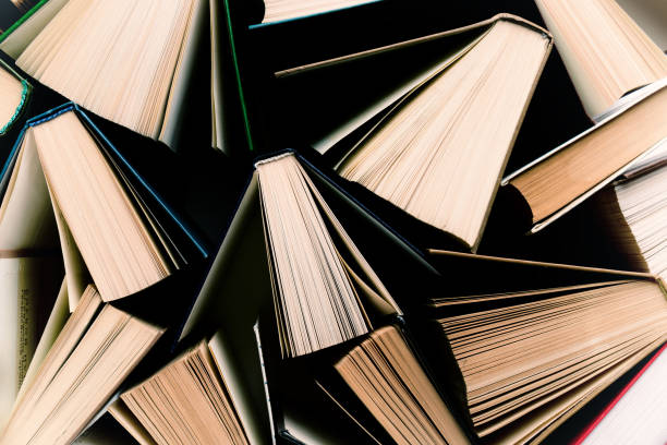istock Education, library or school concept. Many opened books abstract image. Top view 2190168782