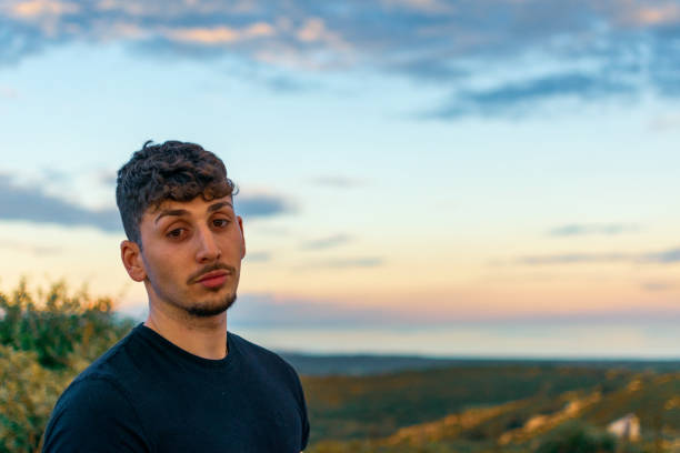 istock close-up of a young man looking at the camera 2190170022