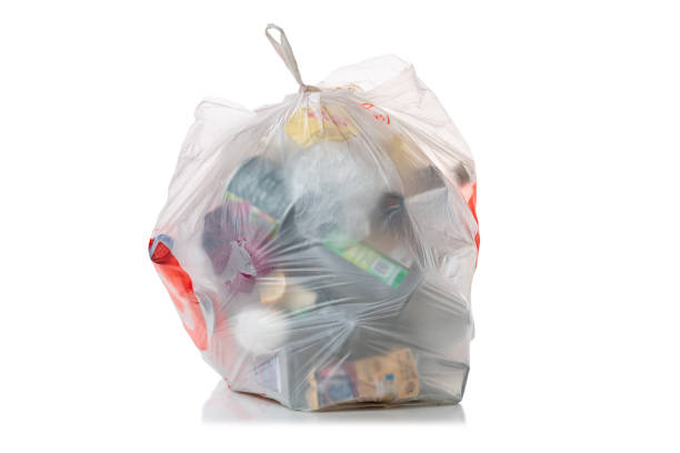 istock White transparent plastic bag or pocket with garbage isolated on white background. Rubbish, junk or trash isolated 2190170557
