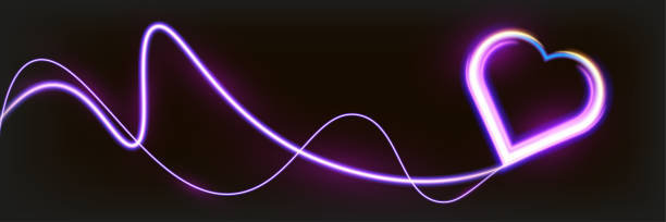 istock Glowing neon heart with vibrant pink and blue lights on background. 2190170575