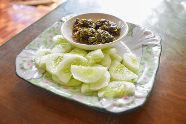 Myanmar or Burmese Traditional Fish Preserve paste, Ngapi htaung and Fresh Cucumber slices in a plate