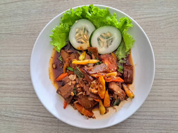 istock Oseng Oseng Mercon Daging Sapi Or Spicy Firecracker Beef Stir Fry With Beef, Lettuce, Cucumber, Leek, Scallions, Cayenne Pepper, Red Chili, Shallots, Garlic, Red Sugar, Coriander, Pepper, Turmeric, Ginger, Sweet Soy Sauce and Salt. Indonesia Food Menu. 2190172271
