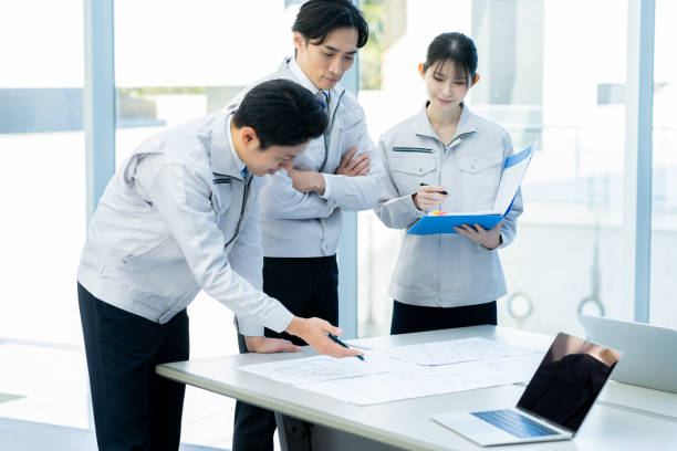 istock Businessmen in work clothes having a meeting 2190172775