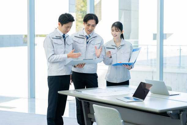 istock Businessmen in work clothes having a meeting 2190172781