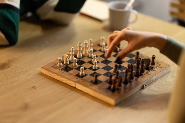 istock Friends playing chess in cafe 2190174131