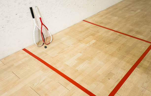 istock Empty squash court and rackets on the wooden floor. 2190178196