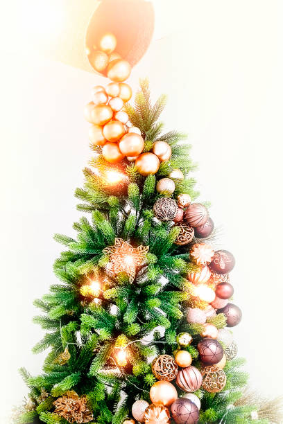 istock Christmas tree decorated with toys on a white background. Vertical photo. 2190178376