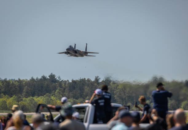 Close-up of a F-15 Fighter jet aircraft flying in the sky.