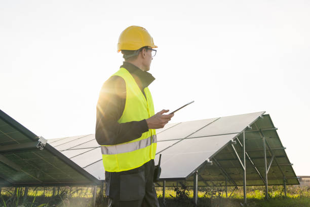 istock Engineer with digital tablet on a background of solar panels. 2190181755