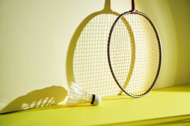 istock Badminton racket and shuttlecock on yellow background. 2190181771