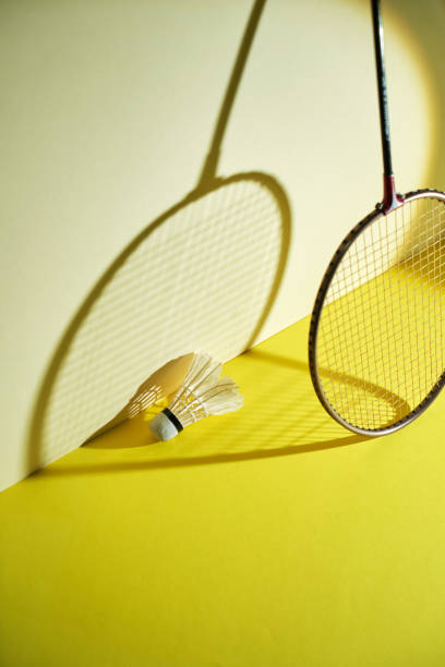 istock Badminton racket and shuttlecock on yellow background. 2190181821