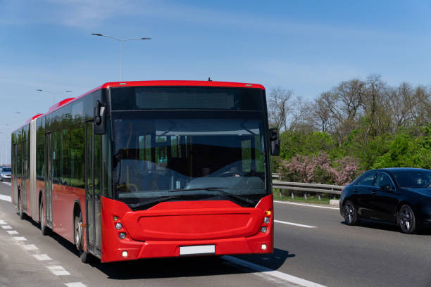 istock Red city bus on the highway 2190182977