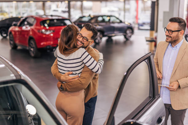istock An attractive couple buying a new car 2190189689