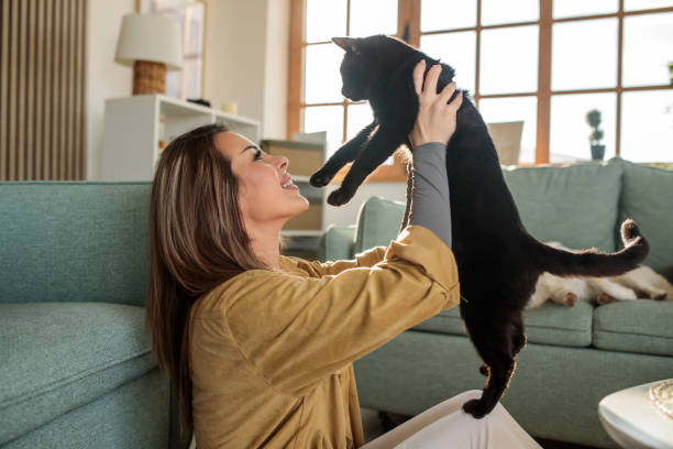 istock Young woman embracing her cat 2190190955