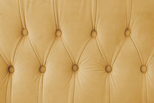 istock Capitone, Chesterfield style suede fabric texture, yellow diamond buttoned turquoise background 2190193461