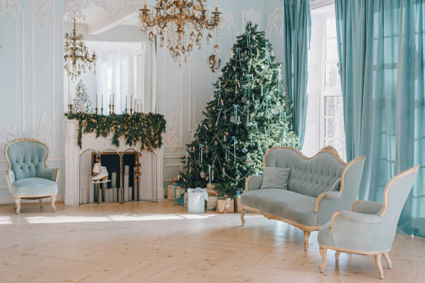 istock Beautifully decorated Christmas tree with gift boxes and vintage couch in elegant room 2190193475