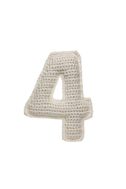istock A crocheted number 4 in white yarn, isolated on a white background, perfect for educational materials, children's decor, or crafting projects. 2190196102