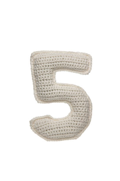 istock A crocheted number 5, white, isolated on a white background, soft texture, handmade, knitted, craft, textile art, DIY project, unique design, decorative, cozy, plush, and charming. 2190196143