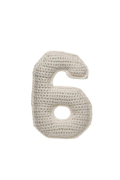 istock A crocheted number 6 in white yarn, isolated on a white background, ideal for educational materials, crafts, or children's decor. 2190196151