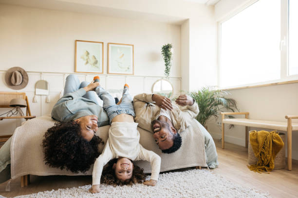 istock Joyful family spending quality time in a cozy bedroom. 2190198683