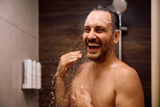 istock Cheerful man under a shower in the bathroom. 2190202069